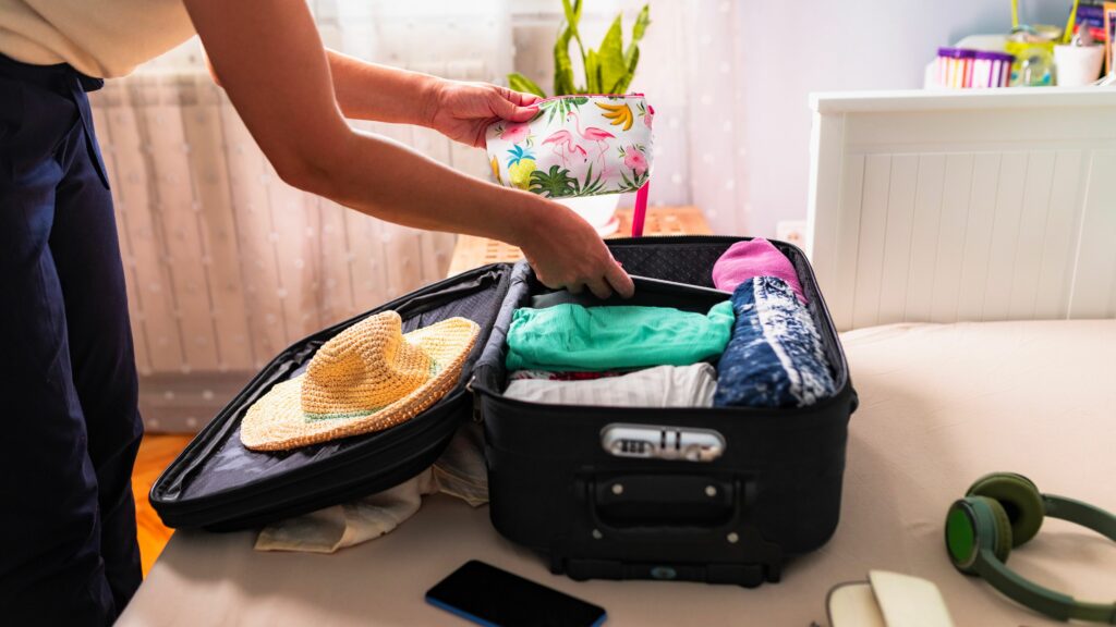 Woman packing a small suitcase