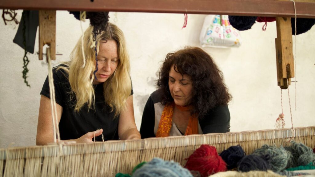 Nebija teaching Undiscovered Balkans co-founder Emma how to weave | Credit: Laura Sanders