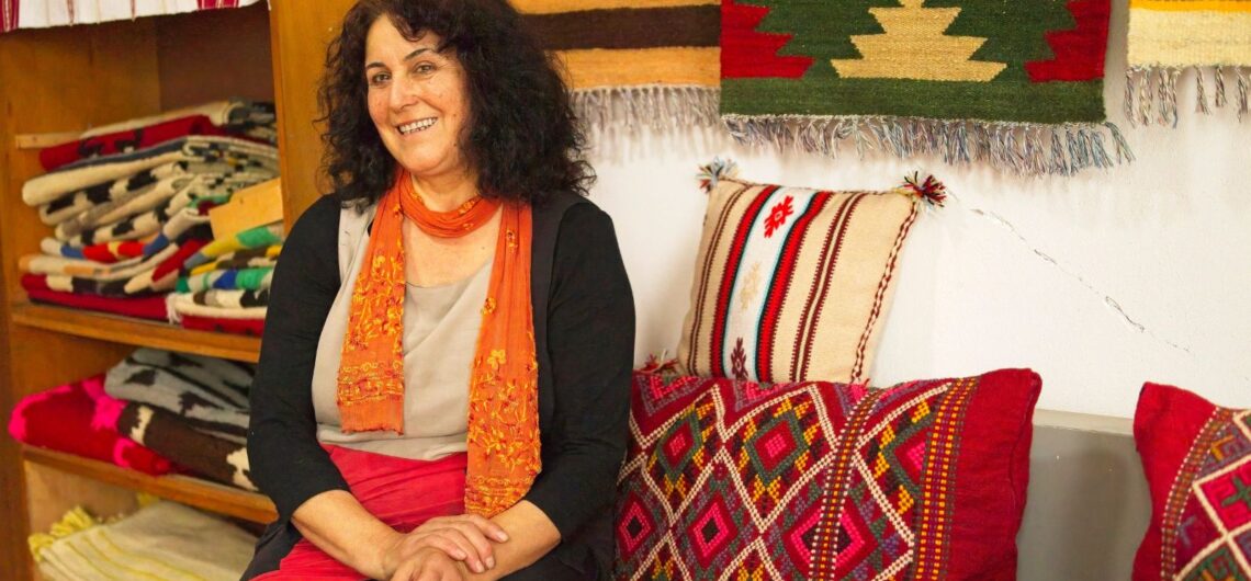 Nebija Qotaj weaves traditional Albanian rugs at her home in North Albania