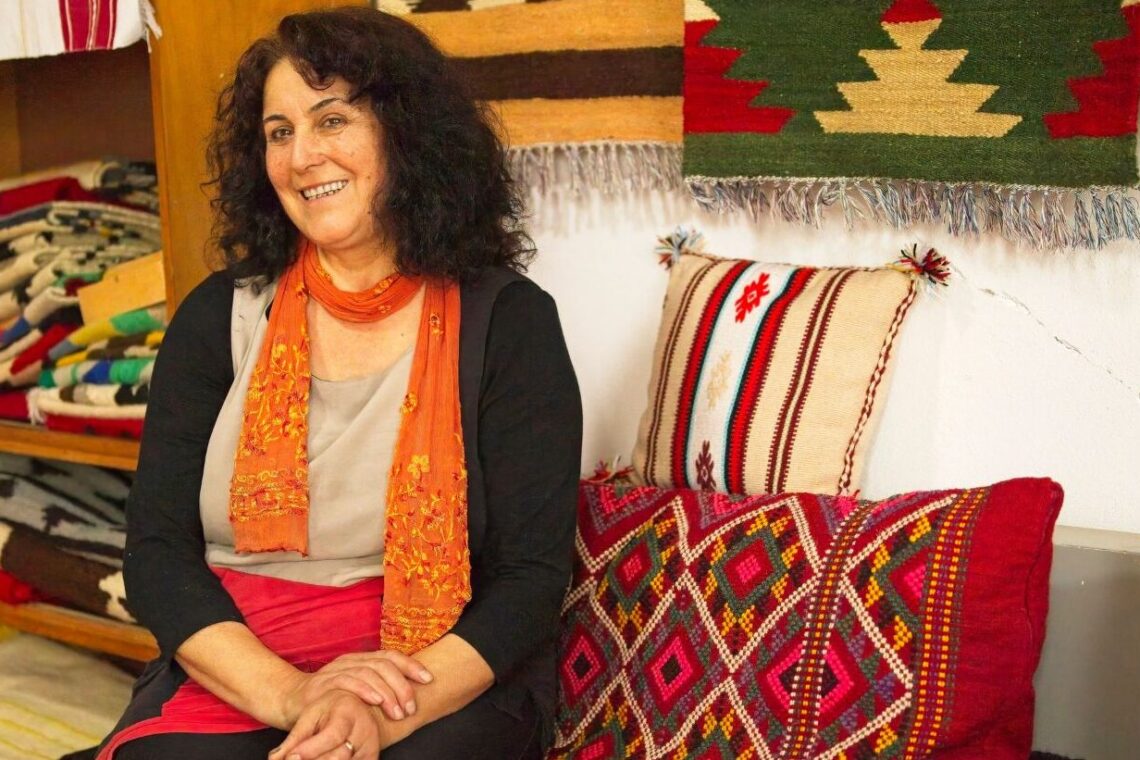 Nebija Qotaj weaves traditional Albanian rugs at her home in North Albania