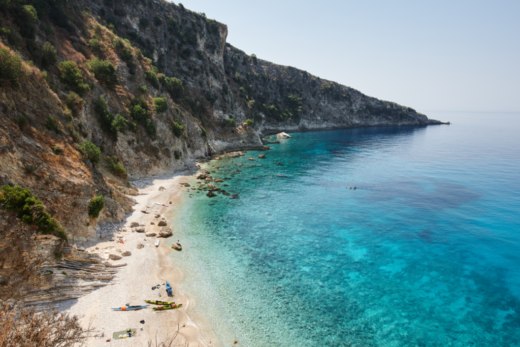 A pristine white sand beach on Albania's Ionian coastline, a place that rewards wild swimmers who are prepared to paddle or hike to reach the less touristy spots.