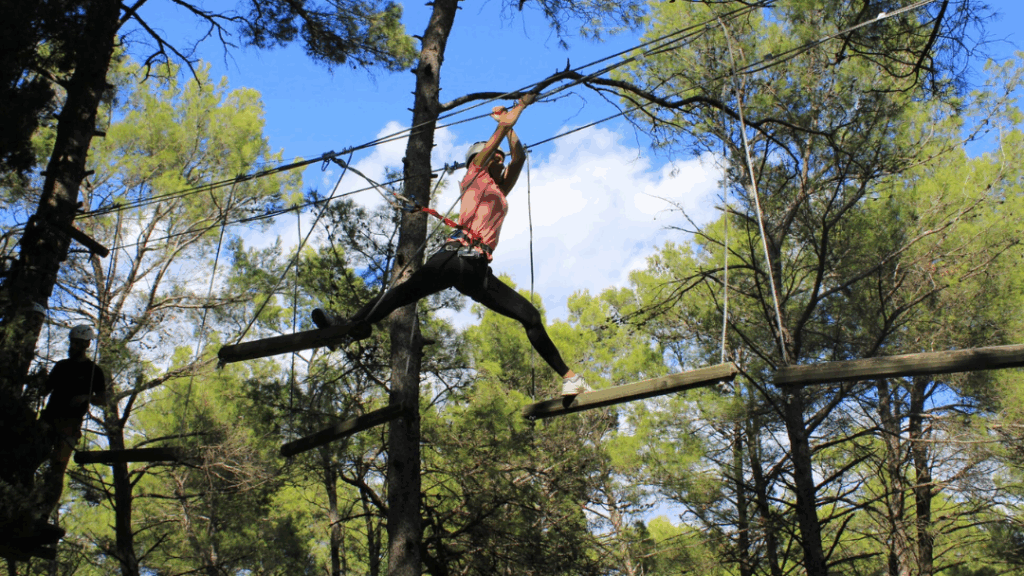 A woman on a high ropes trail at the adventure park in Podgorica on the forested Gorica hill