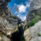 A person abseiling while canyoning in Montenegro on an adventure holiday