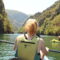 A young girl sitting in a kayak on a family holiday in North Macedonia.