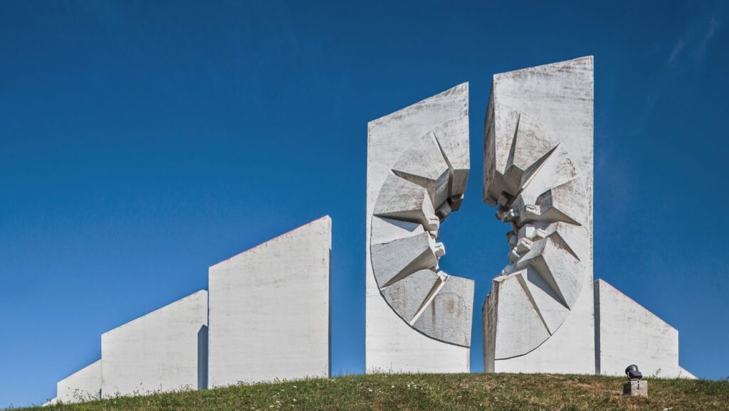 Yugoslav brutalist monuments Balkan hiking holidays modernist architecture former Yugoslavia spoken ik guide Yugoslavia Cold War history Tito's Yugoslavia brutalist architecture Balkans Bosnia hiking holiday Sutjeska national park hiking Montenegro activity holiday North Macedonia travel Balkans adventure travel former Yugoslavia travel guide WWII memorials Europe anti-fascist monuments off-the-beaten-path Europe Balkans nature and culture Yugoslavia architecture tour Belgrade day trips Lake Skadar Montenegro Kozara national park Bosnia Dalmatia coastal hiking Ohrid North Macedonia