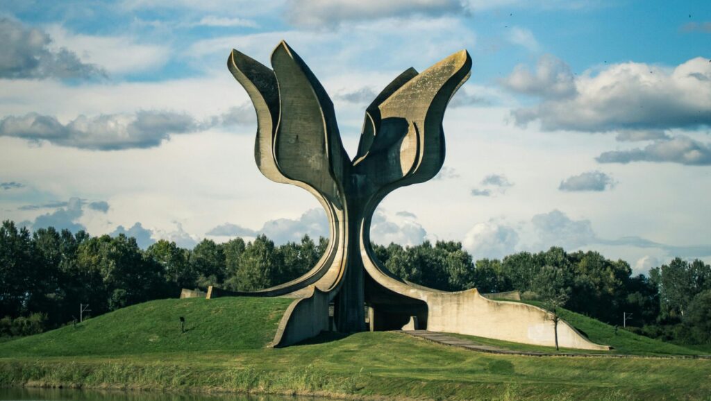 Yugoslav brutalist monuments Balkan hiking holidays modernist architecture former Yugoslavia spoken ik guide Yugoslavia Cold War history Tito's Yugoslavia brutalist architecture Balkans Bosnia hiking holiday Sutjeska national park hiking Montenegro activity holiday North Macedonia travel Balkans adventure travel former Yugoslavia travel guide WWII memorials Europe anti-fascist monuments off-the-beaten-path Europe Balkans nature and culture Yugoslavia architecture tour Belgrade day trips Lake Skadar Montenegro Kozara national park Bosnia Dalmatia coastal hiking Ohrid North Macedonia