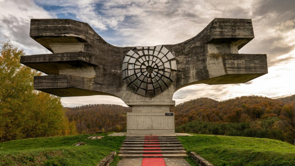 Yugoslav brutalist monuments Balkan hiking holidays modernist architecture former Yugoslavia spoken ik guide Yugoslavia Cold War history Tito's Yugoslavia brutalist architecture Balkans Bosnia hiking holiday Sutjeska national park hiking Montenegro activity holiday North Macedonia travel Balkans adventure travel former Yugoslavia travel guide WWII memorials Europe anti-fascist monuments off-the-beaten-path Europe Balkans nature and culture Yugoslavia architecture tour Belgrade day trips Lake Skadar Montenegro Kozara national park Bosnia Dalmatia coastal hiking Ohrid North Macedonia