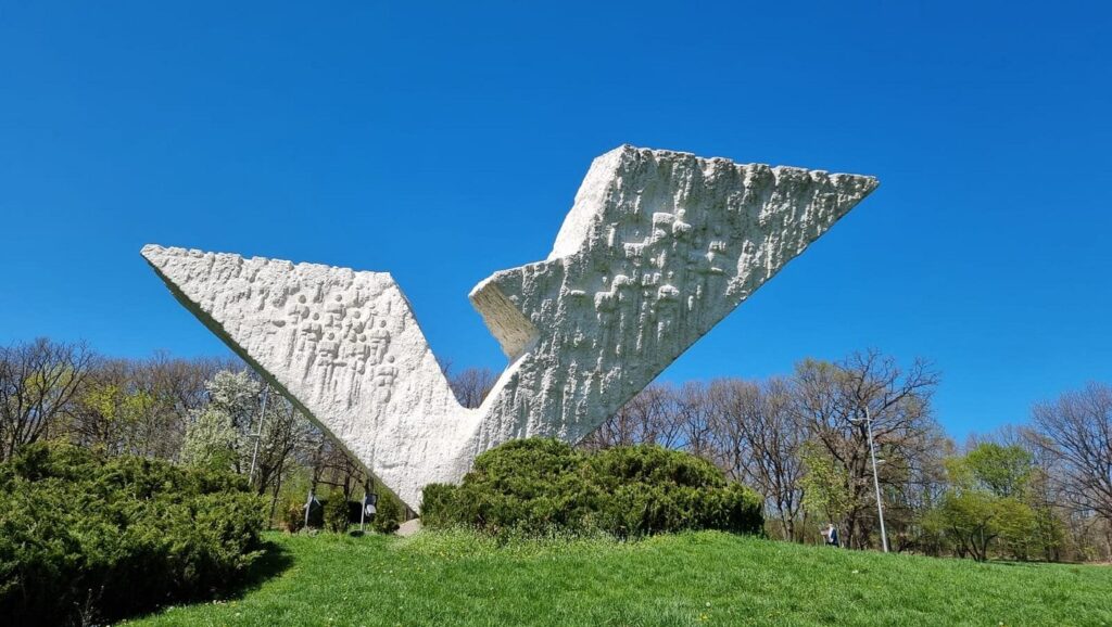 Yugoslav brutalist monuments Balkan hiking holidays modernist architecture former Yugoslavia spoken ik guide Yugoslavia Cold War history Tito's Yugoslavia brutalist architecture Balkans Bosnia hiking holiday Sutjeska national park hiking Montenegro activity holiday North Macedonia travel Balkans adventure travel former Yugoslavia travel guide WWII memorials Europe anti-fascist monuments off-the-beaten-path Europe Balkans nature and culture Yugoslavia architecture tour Belgrade day trips Lake Skadar Montenegro Kozara national park Bosnia Dalmatia coastal hiking Ohrid North Macedonia