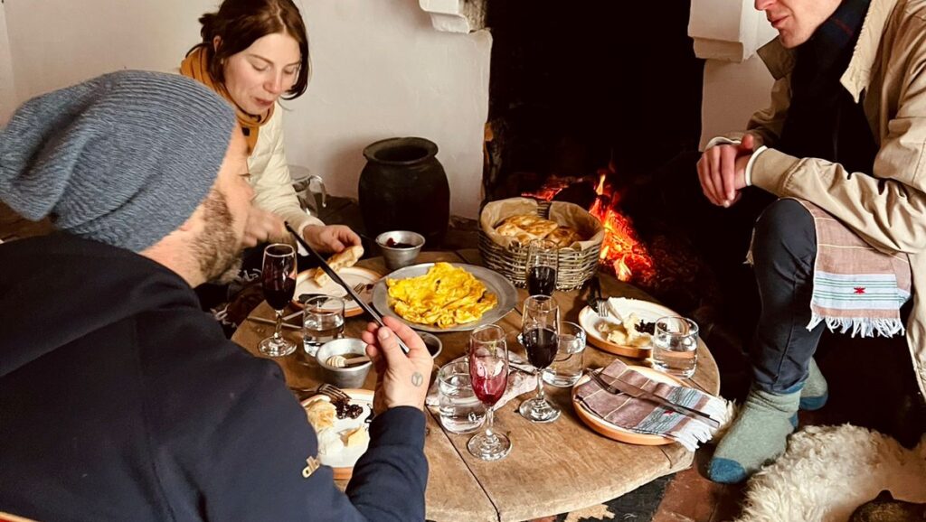 sitting around a sofra table authentic Balkan travel experiencescultural holidays in the Balkans small group Balkan holidays off the beaten track Balkans indigenous traditions Europe experiential travel Europe Balkan food and culture holidays slow travel Balkans