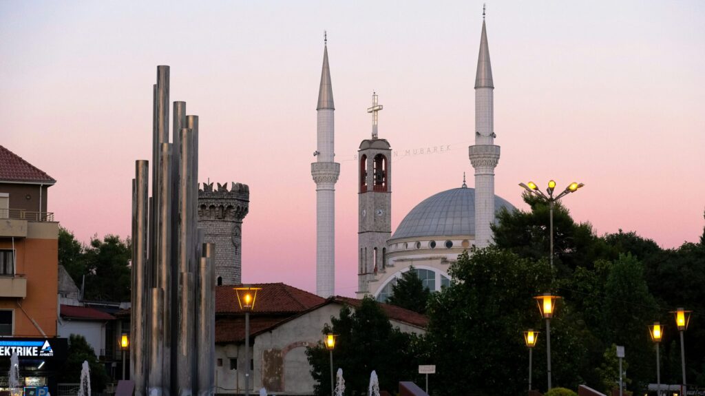 A church and mosque, side-by-side, in Albania.